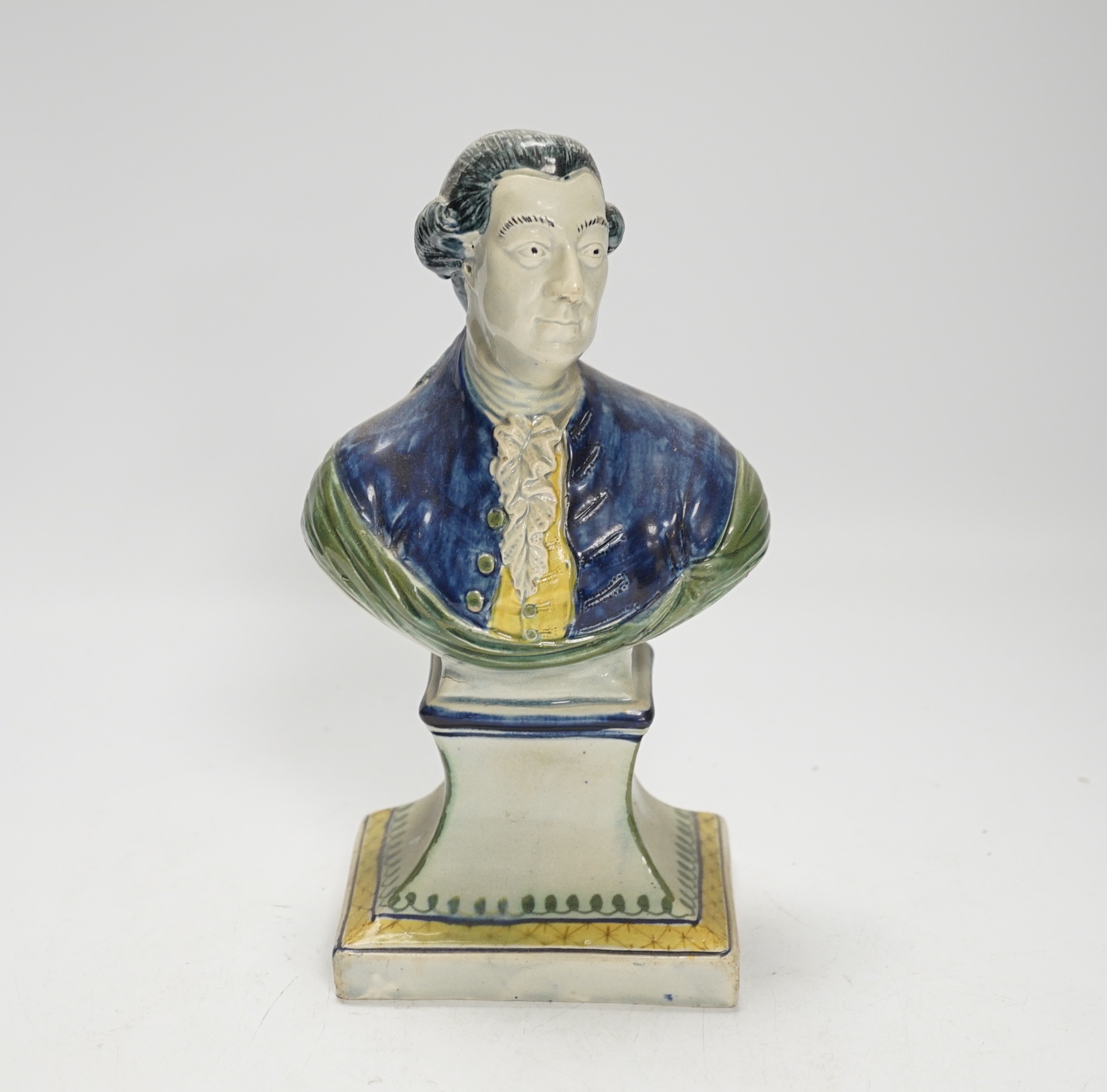 A Staffordshire pearlware portrait bust of a gentleman, possibly William Pitt the Younger, c.1790, painted in Pratt type colours, 23cm high